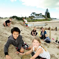 Wainui Beach School helping Coast Care plant bare dune just south of Hamanatua stream - 2011
